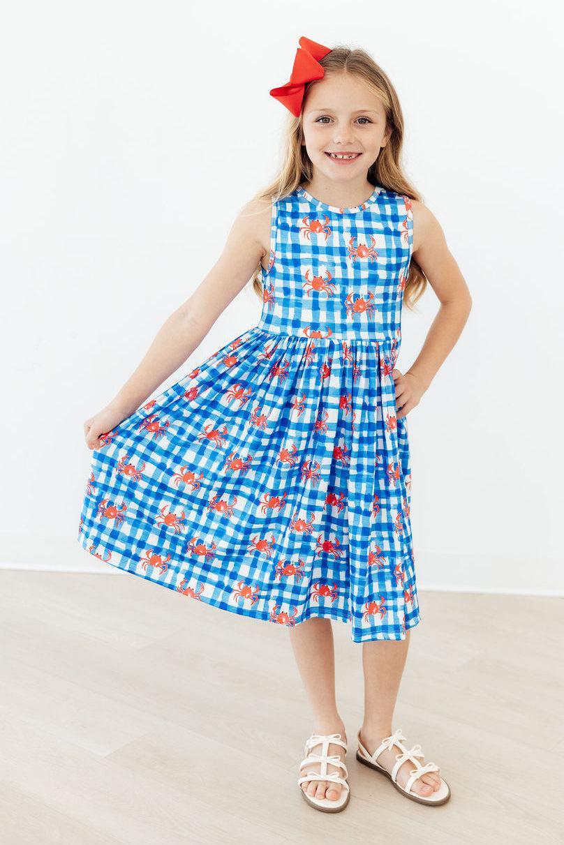 Charming Crabby Cutie Tank Girls Twirl Dress capturing joyful moments with its colorful crab print. A delightful choice for a girls twirl dress.