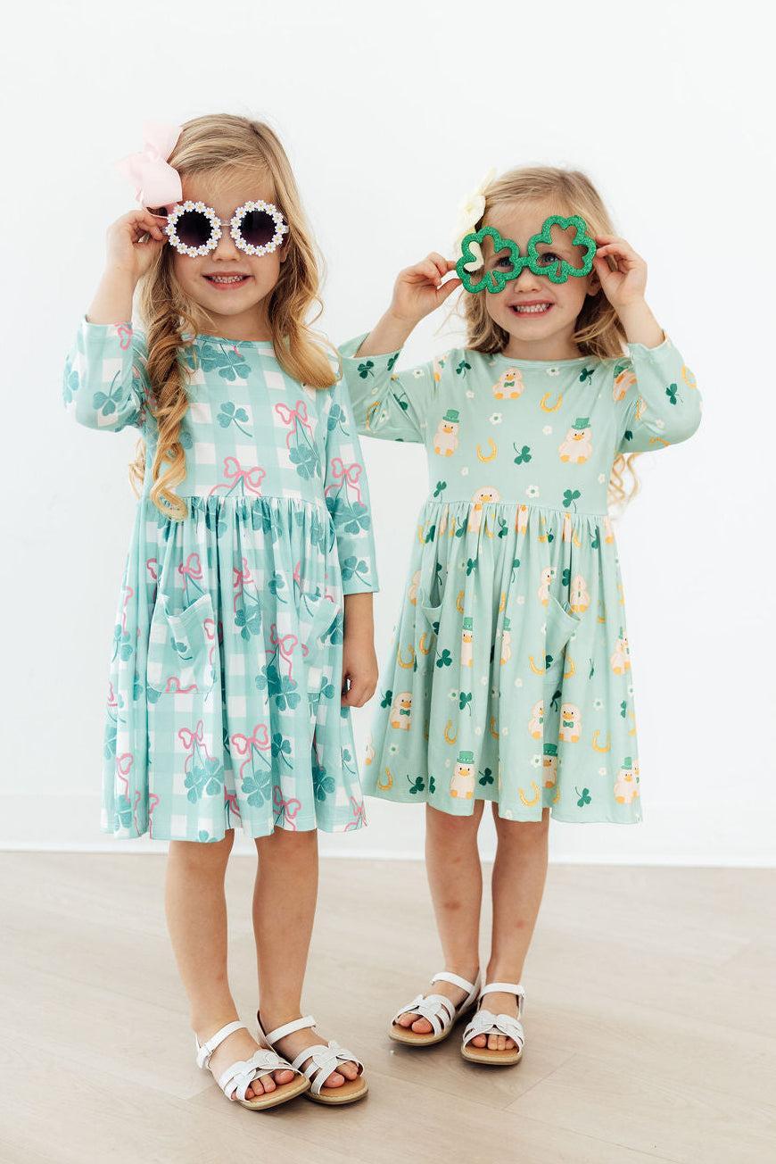 Close-up of the Shamrock Sweetheart 3/4 Sleeve Pocket Twirl Dress for Girls, showcasing its delightful scoop back design.