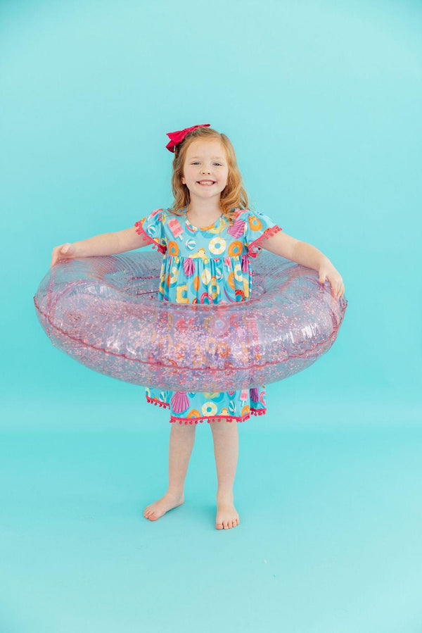 Fun Floaties Pom Pom Summer Dress for Girls showcasing playful pom pom details and vibrant prints, perfect for warm weather wear.