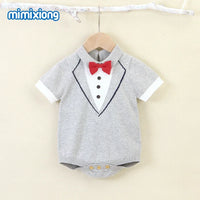 Gray baby boy knit romper with short sleeves, tuxedo design, and red bow tie for infants