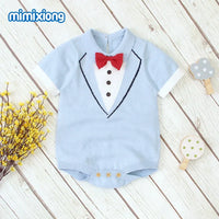 Light blue baby boy knit romper with red bow tie and tuxedo design for infants
