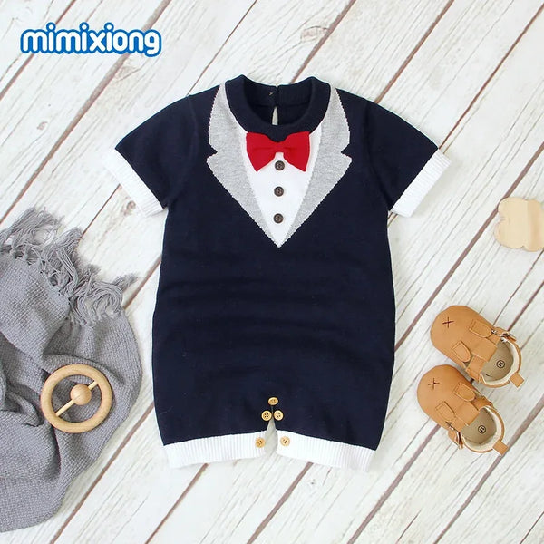 navy blue baby boy knit romper with white tuxedo design and red bow tie, short sleeve newborn size