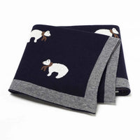 Navy blue cotton baby blanket with white bear design and gray striped edges for infants