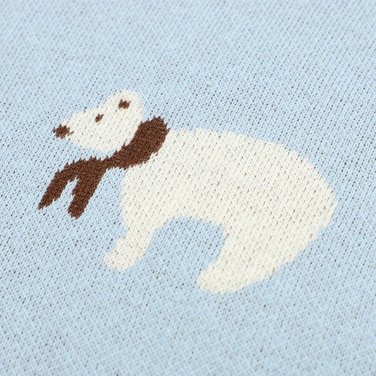 Light blue cotton baby blanket with a white bear wearing a brown scarf design for infants