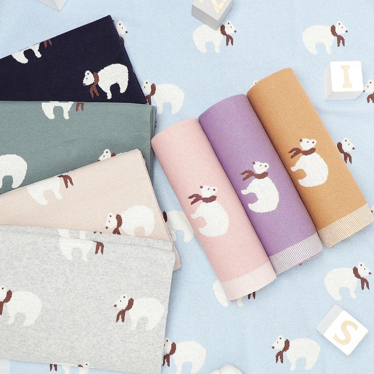 Colorful cotton baby blankets with polar bear pattern in navy, green, beige, gray, pink, purple, and mustard colors for infants