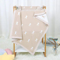 Soft baby bunny blanket in beige with white bunny pattern, suitable for newborns and toddlers