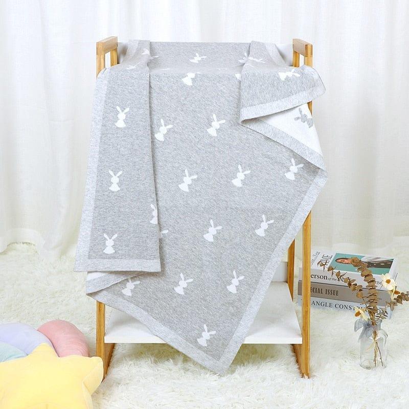 Gray soft baby bunny blanket for infants with white bunny pattern, perfect for cozy swaddling