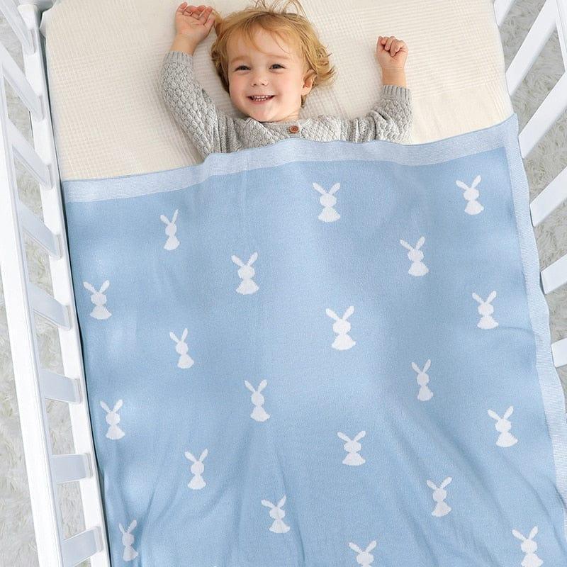 Soft baby bunny blanket in blue with white bunny pattern, suitable for toddlers, perfect for cozy crib use