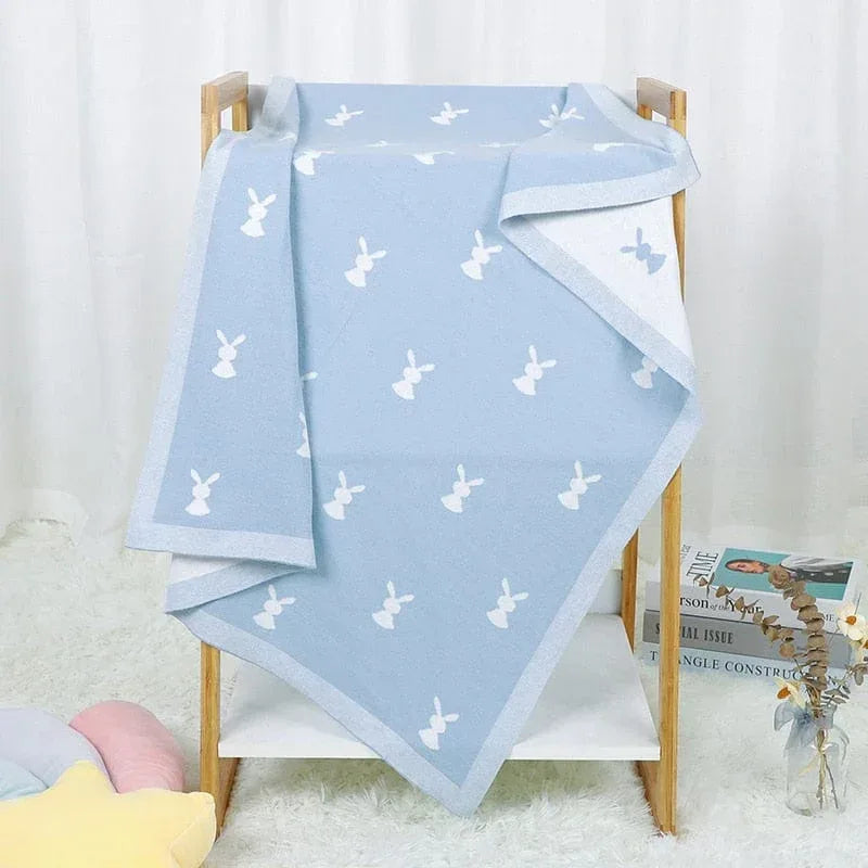Soft baby bunny blanket in light blue with white bunny pattern, perfect for infants and toddlers