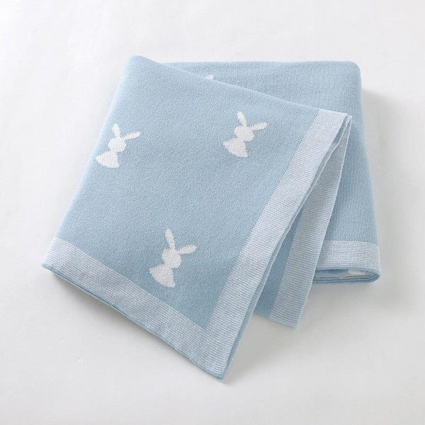 Soft baby bunny blanket in light blue with white bunny pattern perfect for newborns and infants