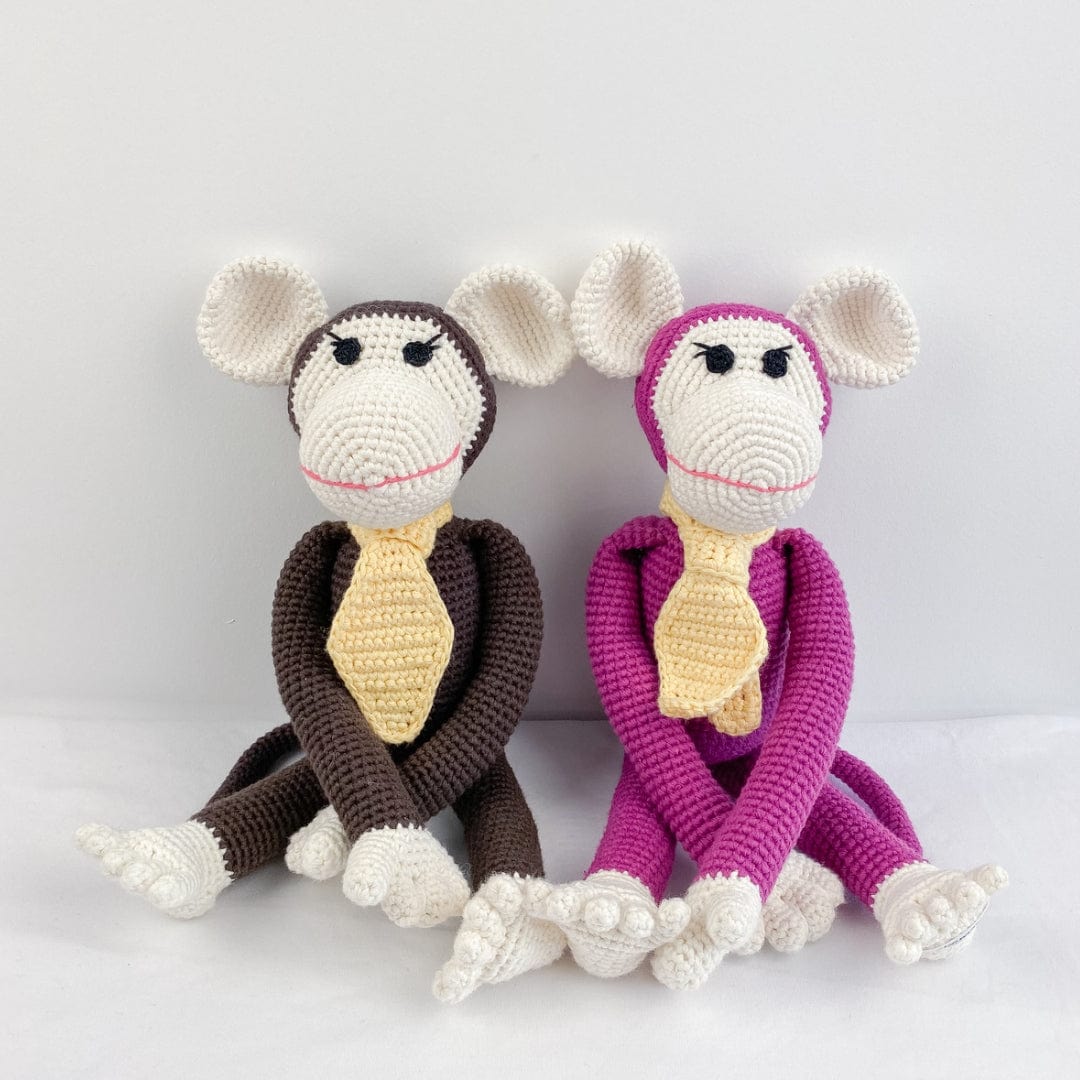 Handmade brown Momo monkey doll with big ears and yellow tie. Cheerful organic cotton toy for nursery decor and pretend play.