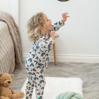Toddler plays in a monster truck print crew neck jogger set. Plush, comfy loose fit matching top and pants for all-day style.