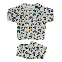 Monster Mash crew neck jogger set featuring a colorful monster truck print on cream fabric for stylish, cozy comfort.