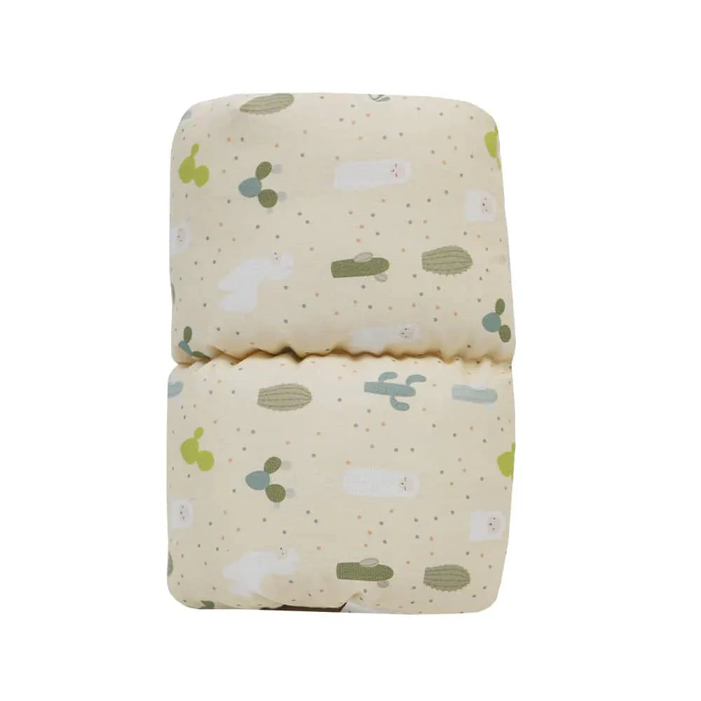 Goosewaddle Murphy Comfy Cradle baby pillow in cream with cactus and animal print for newborns