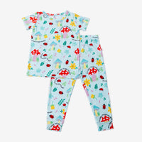 The Second-Skin 2-Piece Short Sleeve Pajama in light blue with hand-drawn mushrooms, flowers and ladybugs.