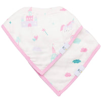 Newborn baby wearing pink edged muslin and terry cloth baby bibs with castle and unicorn prints