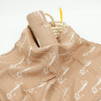 Brown muslin swaddle with white giraffe print for babies and kids soft breathable fabric