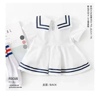 white nautical baby dress for infants with navy blue stripes and sailor collar detail