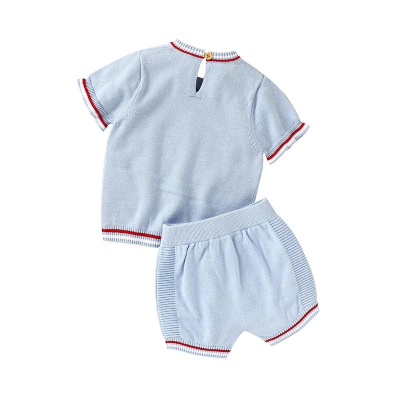 Light blue nautical baby outfit for infants with short sleeve top and matching shorts with red and white trim
