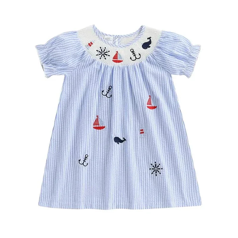 light blue and white striped nautical smocked dress for girls with embroidered sailboats and anchors