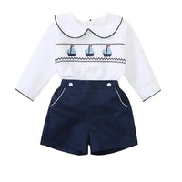 nautical smocked romper for baby boys with white long sleeves and navy shorts size newborn