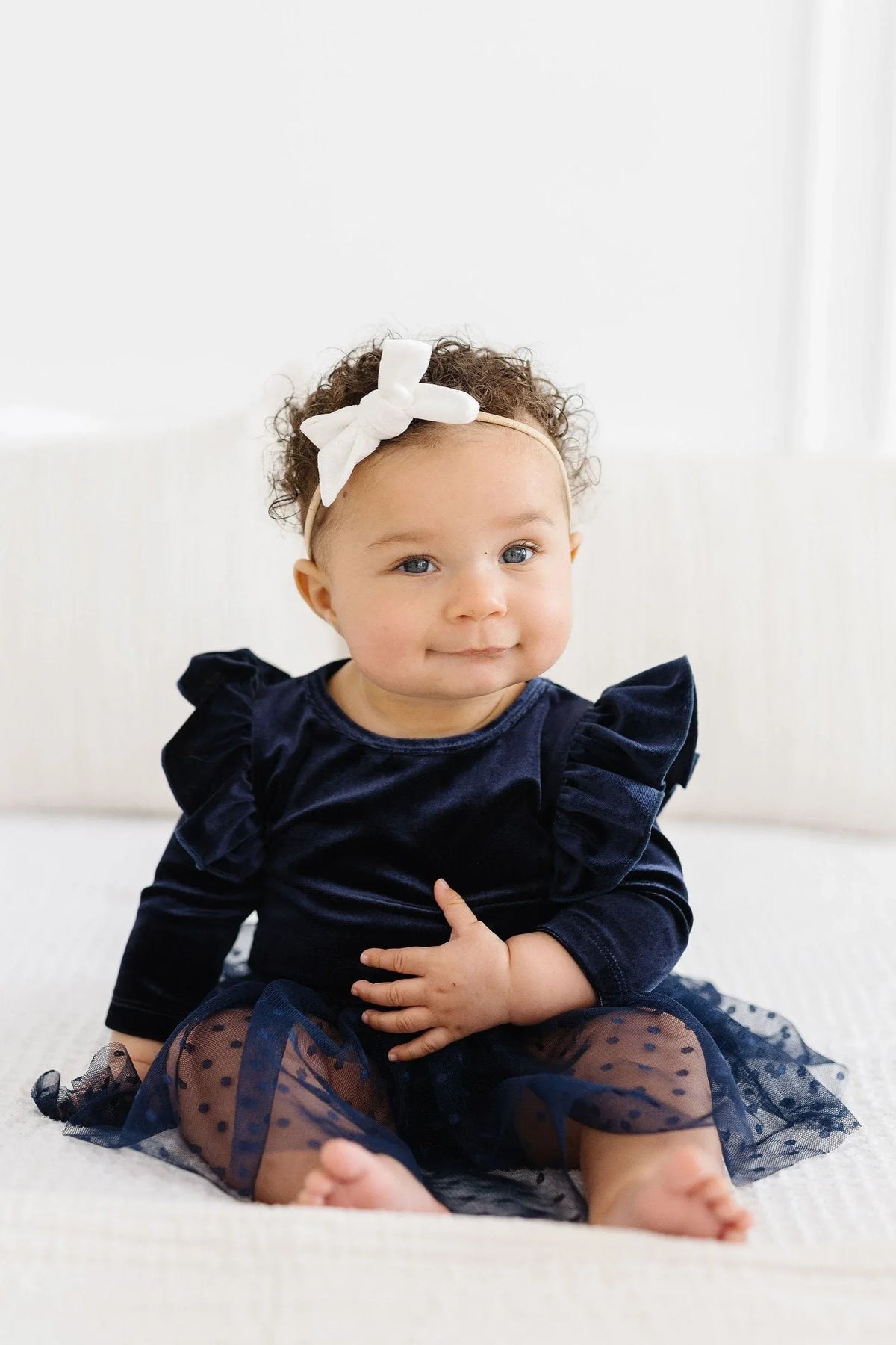Navy velvet tutu bodysuit for baby girls with ruffle sleeves and polka dot mesh skirt