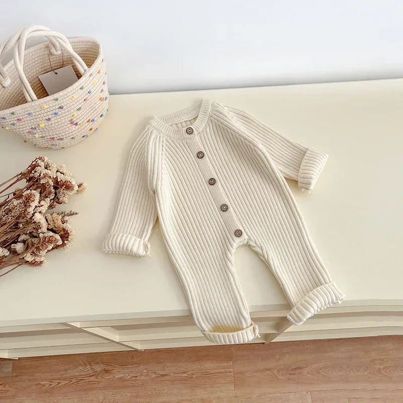 neutral baby romper knit 3-24 months in cream color with button front and long sleeves
