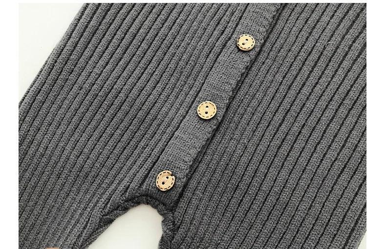 neutral baby romper knit 3-24 months in dark gray with ribbed texture and wooden buttons