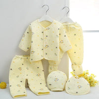 yellow newborn baby layette set with long sleeve jacket, footed pants, pants, hat, and bib for infants