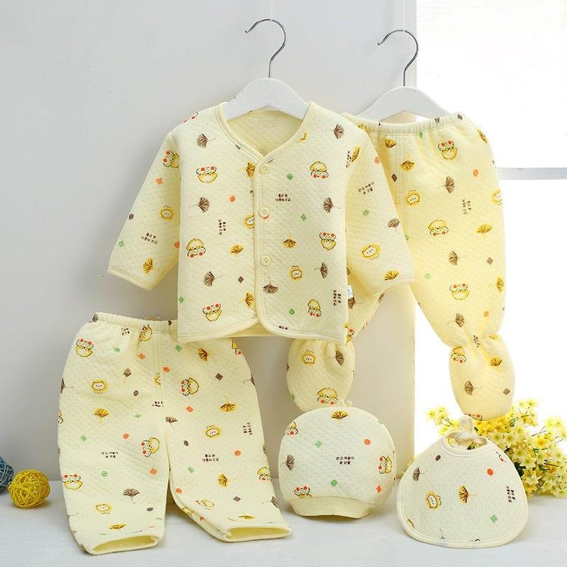 Yellow newborn baby layette set with long sleeve top, pants, hat, and bib featuring cute animal prints