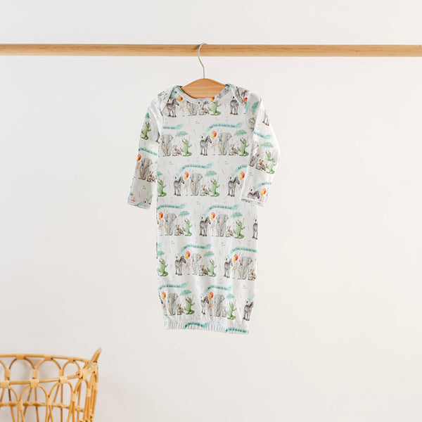 And They All Asked For You Organic Cotton Kids Sleepwear romper on a hanger with a colorful animal print.