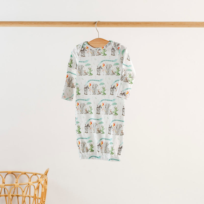 And They All Asked For You Organic Cotton Kids Sleepwear romper on a hanger with a colorful animal print.