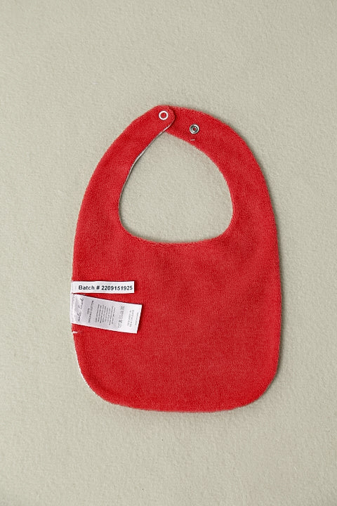 My First Crawfish Boil Organic Cotton Baby Bib, red with snaps and a tag label.