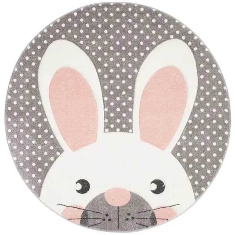 Round grey and white baby nursery rug with pink bunny ears and polka dot background