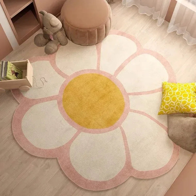 Soft baby nursery rug shaped like a large flower with white petals, pink edges, and yellow center