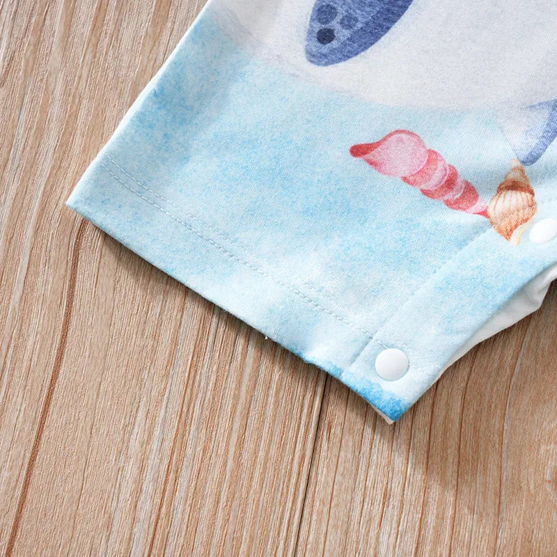 Blue and white cotton ocean themed baby romper with shell and sea creature print and snap buttons