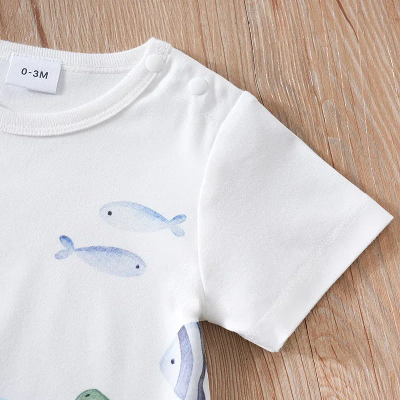 White cotton ocean themed baby romper with blue fish print for infants 0-3 months
