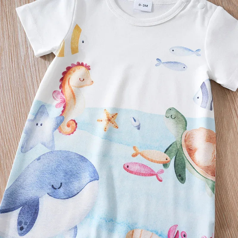 White cotton ocean themed baby romper with colorful sea animals like whale, turtle, and seahorse