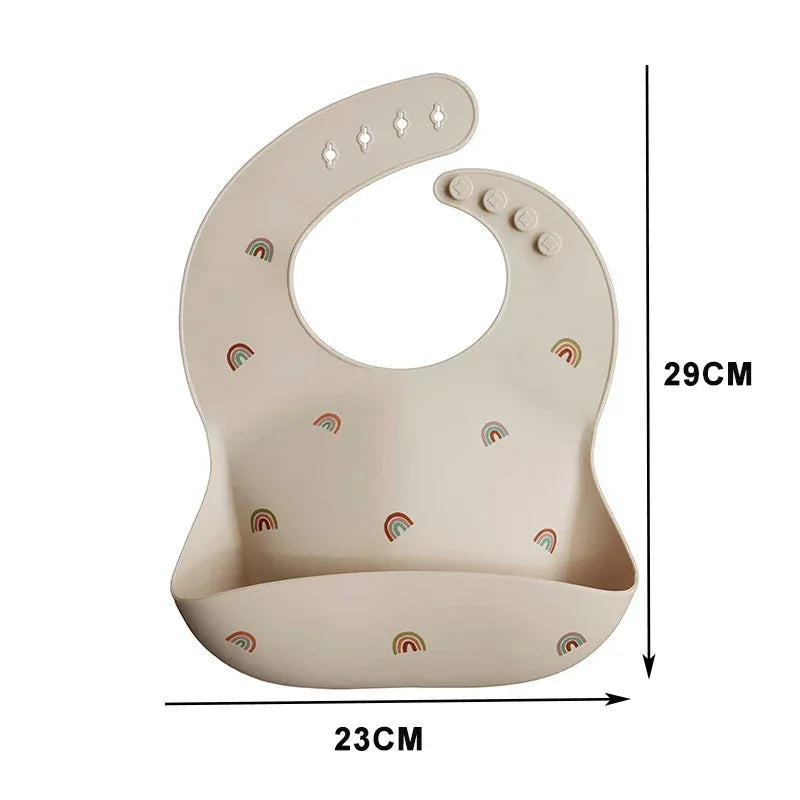 Beige waterproof baby bibs with rainbow prints for infants measuring 23 by 29 centimeters