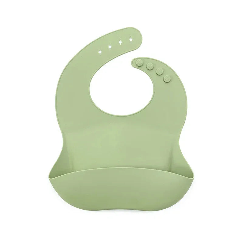 Light green silicone waterproof baby bibs for infants with adjustable button closure and food catcher pocket