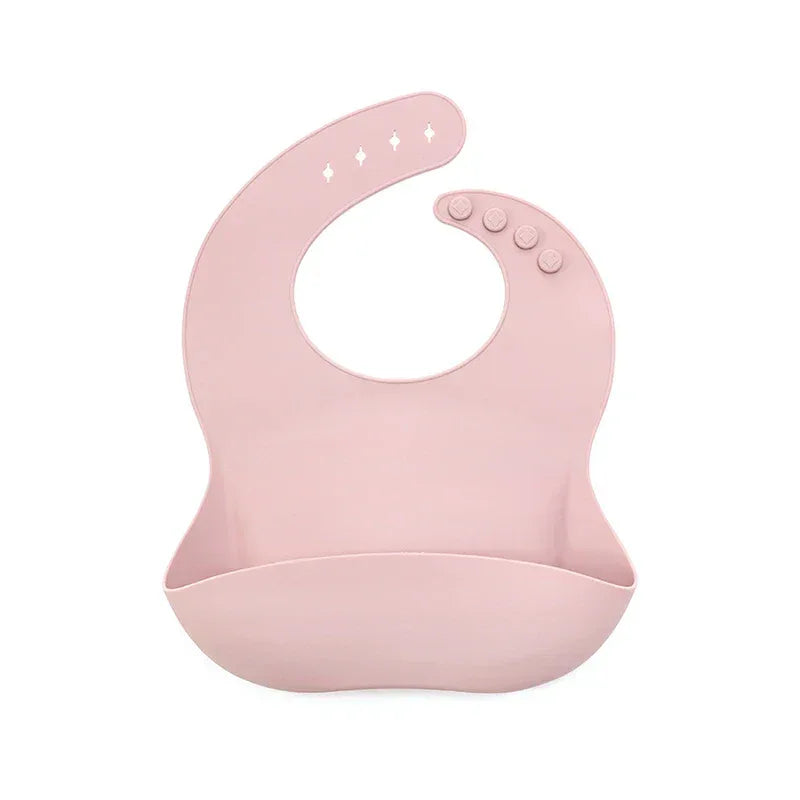 pink waterproof baby bibs made of soft silicone with adjustable buttons for babies and toddlers