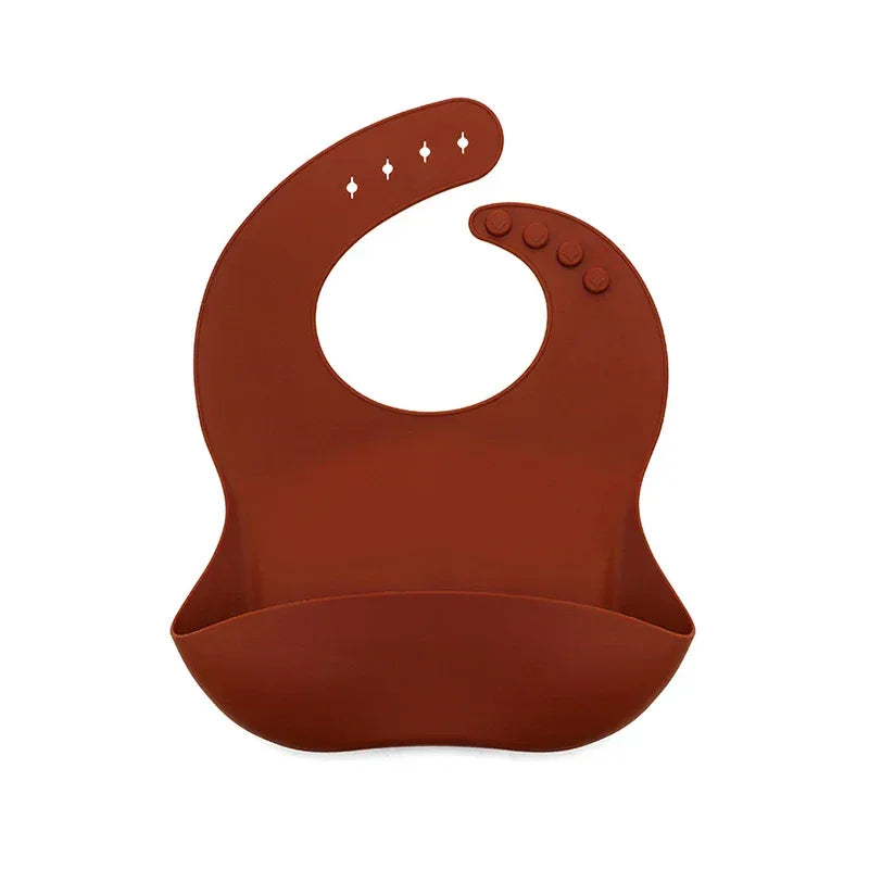 rust-colored waterproof baby bibs designed for babies with adjustable neck fasteners