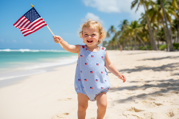 Patriotic baby rompers featuring a blue and white striped design with small American flags. Perfect summer outfit for babies with convenient snaps for easy diaper changes.
