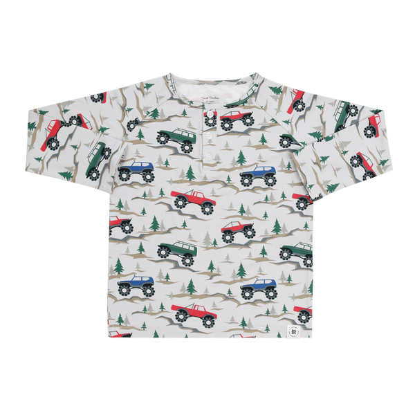 White raglan henley for kids featuring a monster truck and pine tree print with a buttoned front placket for comfort.
