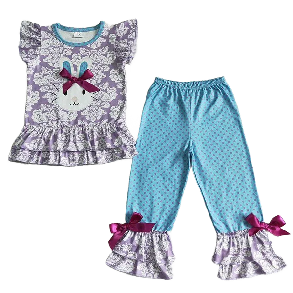 toddler girls pant set with purple ruffle top featuring bunny face and blue polka dot pants with ruffle hems and bows