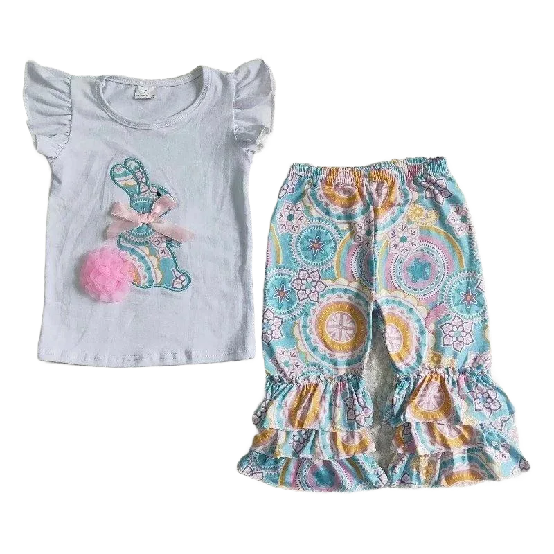 White baby pant set with ruffle sleeves and colorful bunny applique paired with patterned ruffle pants