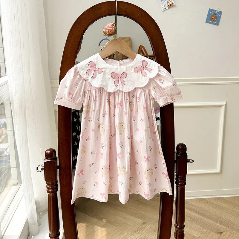 baby pink party dress with puff sleeves and bow embroidery on white collar for infants