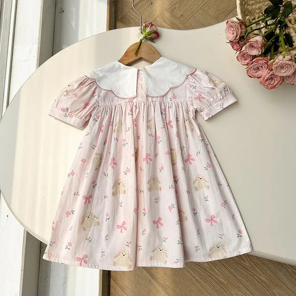baby pink party dress with white collar and puff sleeves featuring bear and bow prints