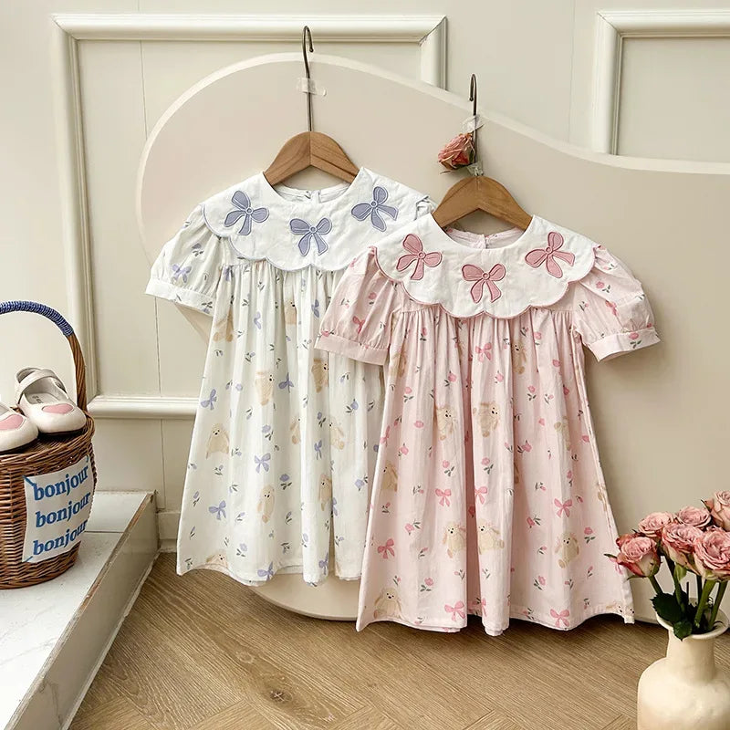 Girls white and pink party dress with bow embroidery and floral print, short sleeve for toddlers