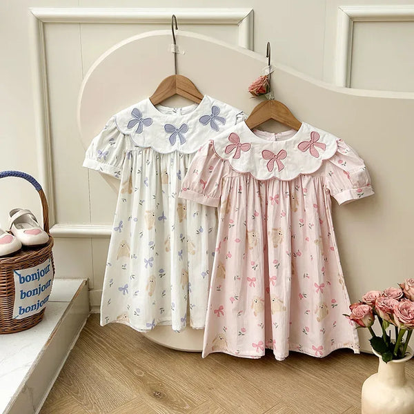 Girls white and pink party dress with bow embroidery and floral print, short sleeve for toddlers